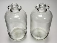 A pair of clear glass demijohn gallon jars. (h-31.5cm) (2)