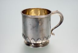 An Edwardian Birmingham Wilson and Sharp Edinburgh silver christening mug with lotus leaf lappet