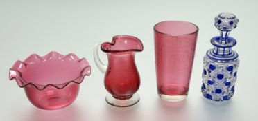 A collection of cranberry glass comprising, a scalloped edge bowl (h-6.5cm), a tumbler glass with