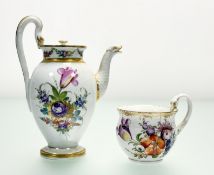A Meissen teapot decorated with hand painted floral display highlighted with gilt edges and