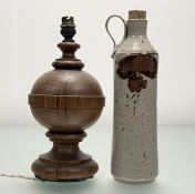 A carved wooden coverted finial table lamp (h-31cm) together with a Studio Pottery salt glazed