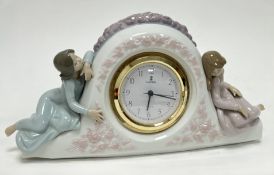 A Lladro 'Two Sisters' figural mantel clock, No.5776, modelled with two girls flanking a clock face,