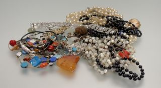 A collection of costume jewellery to include paste pearl and bead necklaces, rings, micro mosaic