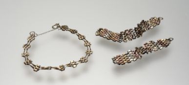 A 9ct gold gatelink bracelet with ring fastening and safety chain: d. x 8cm 2.8g together with a 9ct
