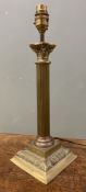 A 20th century brass Corinthian column table lamp, fluted shaft on square base with leaf detail (