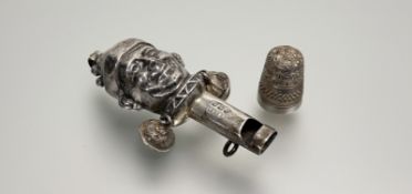 A Birmingham silver mask infants rattle and whistle: l. x 7.5cm Birnigham 1922 and a Birmingham