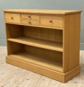 A modern oak bookcase sideboard, fitted with four drawers to front over adjustable shelf, raised