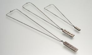 A silver ingot pendant: l. x 5cm on silver chain link necklace with ring fastening: total l. x
