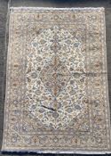 A fine hand-knotted Persian Kashan carpet, central panel with medallion surrounded by scrolling