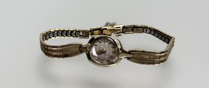 A vintage 10ct gold filled manual wristwatch with silvered dial and arabic numerals: d. x 1.5cm on