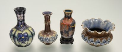 A collection of various decorative wares comprising, a Moorcroft Violet pattern bud vase, marked