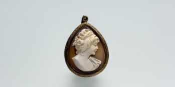 A 9ct gold pear shaped pendant set shell carved cameo portrait on 9ct gold trace link chain necklace
