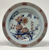 A 19thc Japanese porcelain charger in the Imari palette, with flowering prunus, chrysanthemums,