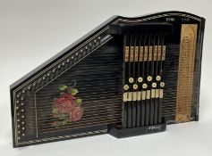 A German Rosetti Autoharp, 32 string, 1960s, finished in black with painted roses to body (missing