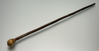 A wooden walking stick, with an oval knop to top and brass metal cap to base. (l-90cm)