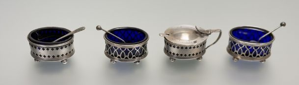 A George V Sheffield silver two-piece cindiment set comprising a pair of oval salts with original