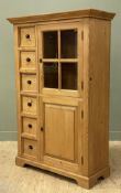 A 20th century pine pantry cupboard, with moulded cornice over glazed cupboard door enclosing
