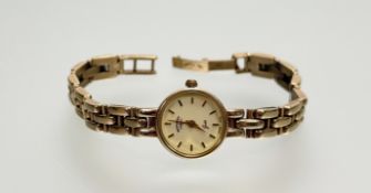 A 9ct gold Rotary quartz wristwatch with gilt dial and baton hour markers: d. x 1.5cm on 9ct gold