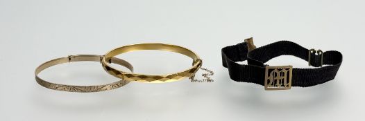 A 9ct gold core diamond pattern stiff-hinged bangle with safety chain: d. x 5.5cm together with an