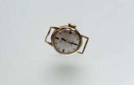 A 9ct gold vintage manual wind Rotary wristwatch with silvered dial and baton hour markers: d. x 1.