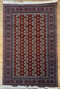 A modern hand-finished Turkish Buhara rug, unused condition, central panel with repeating gul