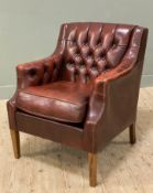 A reproduction Victorian-style club chair, oxblood leather with button-back and cushion seat,
