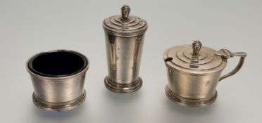 A Chester Walker & Hall Art Deco silver three piece condiment set comprising a pepper pot with