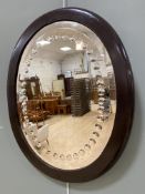 An Edwardian oval wall mirror, oval bevelled plate with convex circular edge, enclosed within a