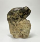 A carved soapstone sculpture of a chameleon modelled on a rockface, signed 'C. Andreas' (h. 26cm)