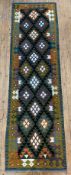 A hand-knotted Maimana kilim runner, central field with repeating diamond design enclosed within a