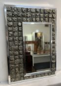 Ron Hitchins (British, 1926-2019) a large wall-hanging mirror with off centred mirror panel, flanked
