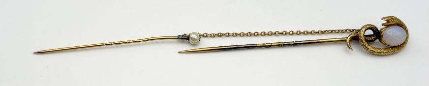 An Edwardian yellow metal serpent top stick pin set cabochon water opal approximately 0.75ct: l. x