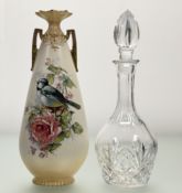 An Early 20thc Art Nouveau twin handled vase by Alexandra Porcelain Works, decorated with a