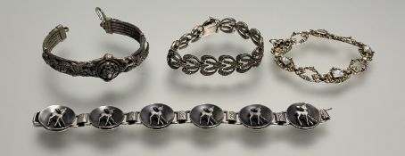 A white metal roccoc style panel link bracelet set four cushion-cut pale blue stones with clip