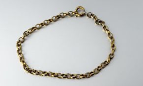 A yellow metal oval link chain bracelet with a ring fastening - hard solder to the ring fastening: