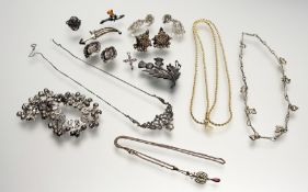 A silver rope twist necklace mounted with seven various charms: l. x 19cm together with a silver