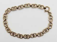 A 9ct gold cast double circuler link chain bracelet with ring fastening: d. x 8cm 7.8g