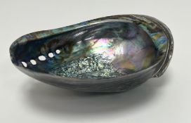 A large iridescent shell with pierced decoration to side (l. 20cm x h. 8cm)