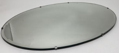 An Art Deco frameless bevel edge wall mirror of oval form (l. 68.5cm), together with another Art