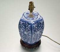 A Chinese blue and white tall pumpkin form chinoiserie pattern converted table lamp, raised on
