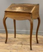 A late 19th century French bureau de dame, inlaid rosewood with serpentine front, gilt metal ledge