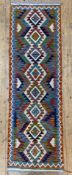 A hand-knotted Chobi kilim runner, central panel with repeating geometric and diamond motifs,