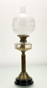 A Victorian Duplex brass corinthian column oil lamp, raised on circular stepped base, with
