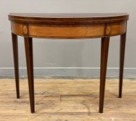 A George III mahogany and satinwood fold-over card table, crossbanded top over baize-lined playing