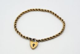 A 9ct gold rope bracelet with a 9ct gold padlock - hard solder to the bracelet loop end: d. x 6.