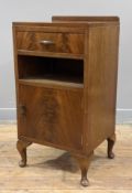 A 1930s Art Deco burr walnut bedside cabinet, ledge back with single drawer and cupboard door to