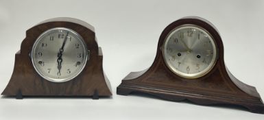 A 1920s Napolean Hat-style mahogany mantel clock, with checkered inlay and flame mahogany panel,