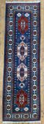 A modern hand-knotted Caucasian Kazak runner, central panel with four geometric medallions