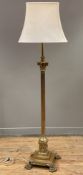 An Edwardian brass standard lamp, telescopic stem with Corinthian capital raised on fluted column,
