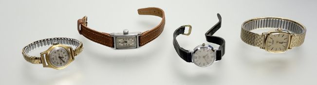 A vintage Rotary stainless steel manual wind tank-shaped watch with silver dial and arabic numerals: